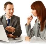 A house with a roof under construction on top of some plans