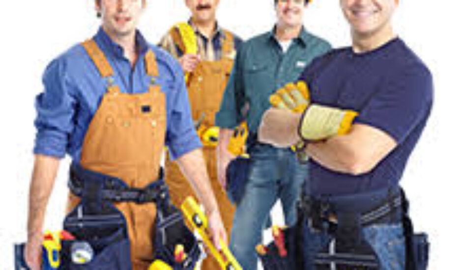 A group of men in construction hats and tools.