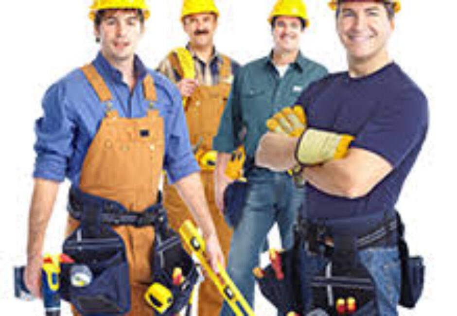 A group of men in construction hats and tools.