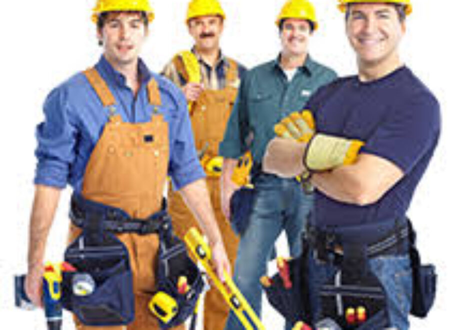 A group of men in construction hats and tools.