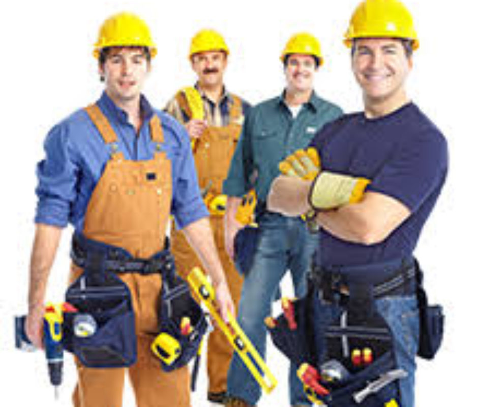 A group of men in construction hats and tools.