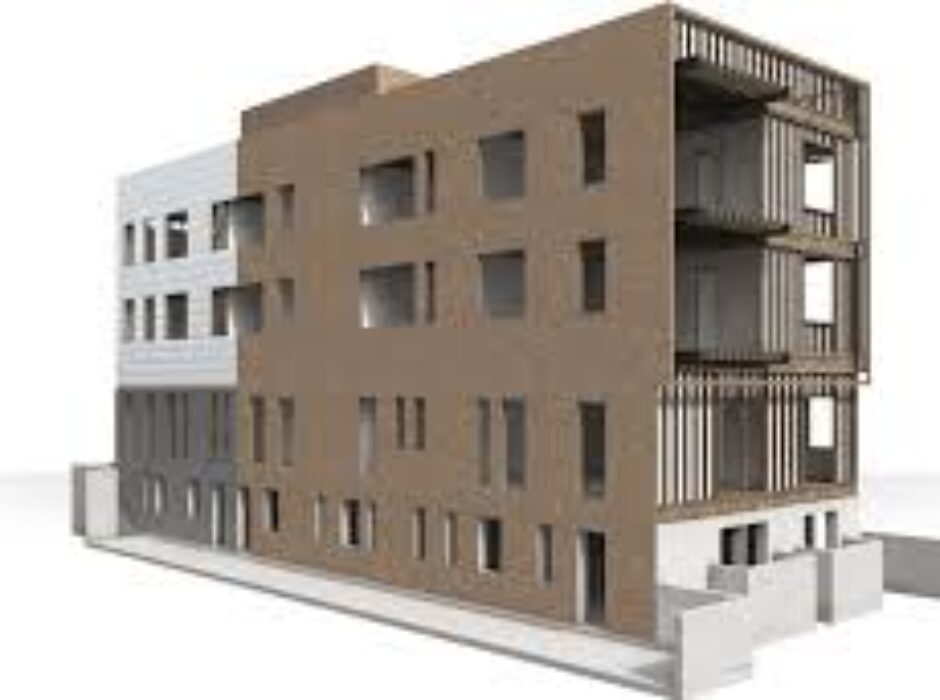 A building with two floors and one has a balcony.