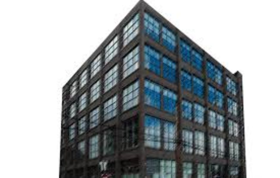 A large building with many windows on the outside.