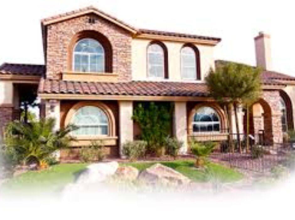 A house with two windows and a large lawn.