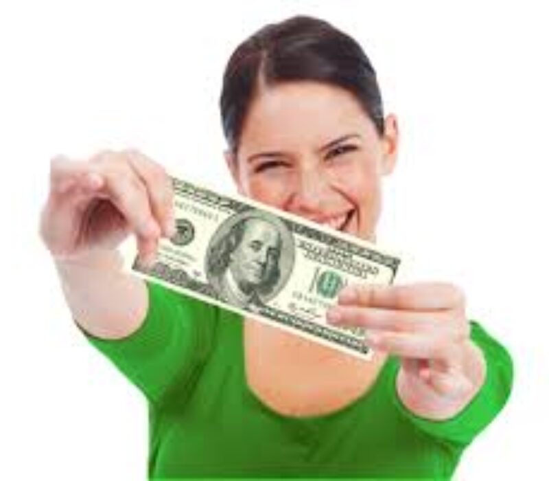 A woman holding up a $ 1 0 0 bill in front of her face.