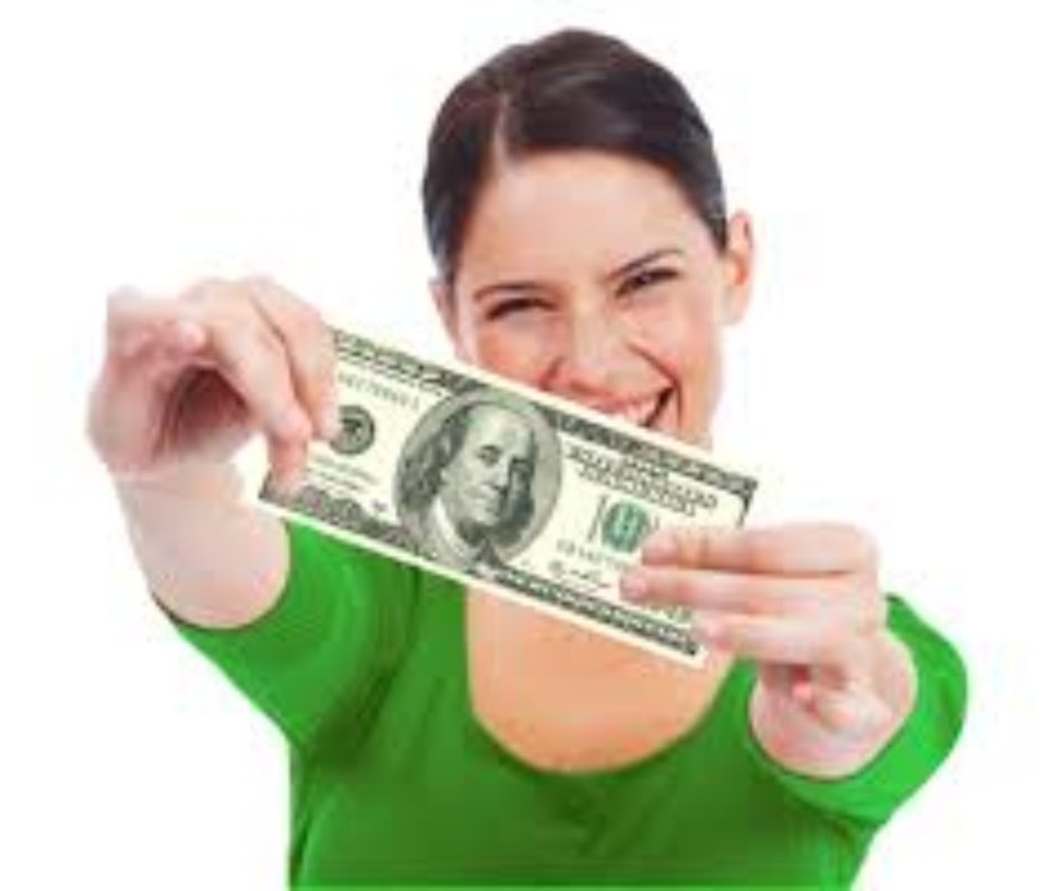 A woman holding up a $ 1 0 0 bill in front of her face.