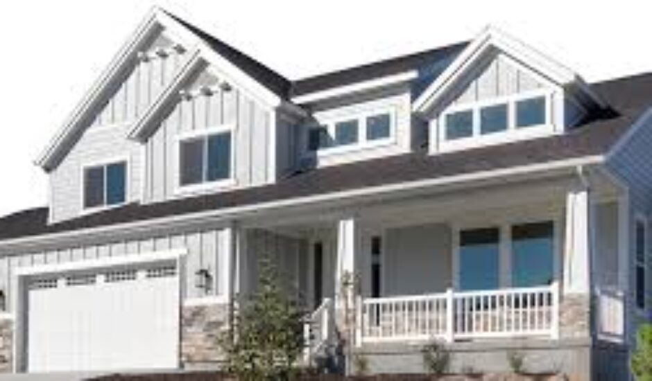 A large white house with a porch and balcony.