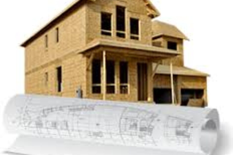 A house with plans and construction drawings on top of it.