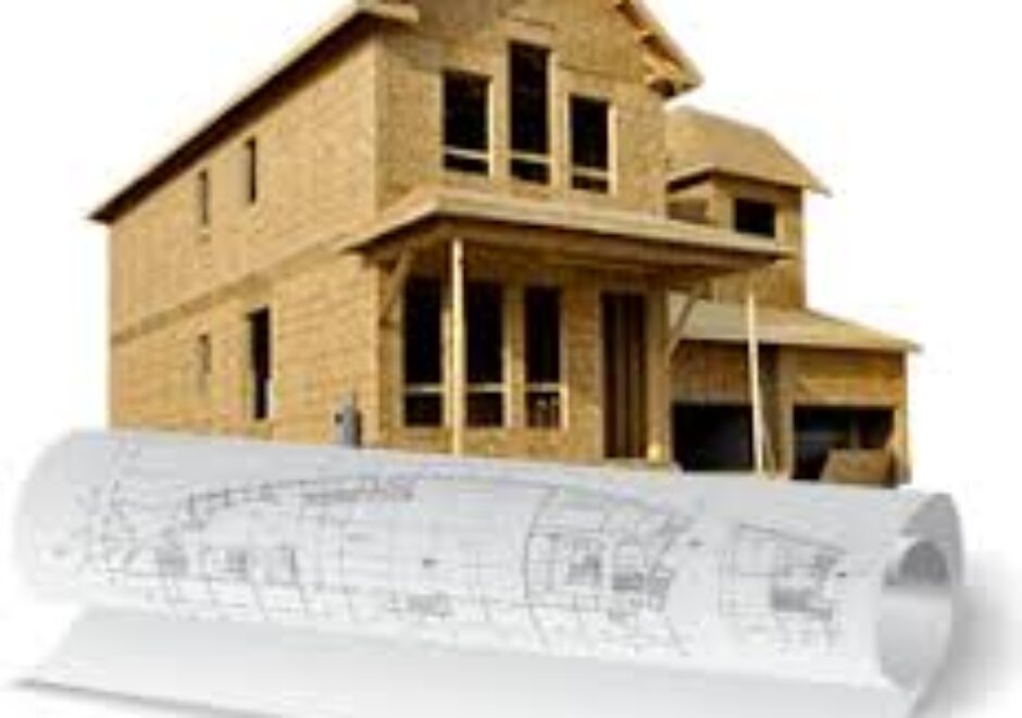 A house with plans and construction drawings on top of it.