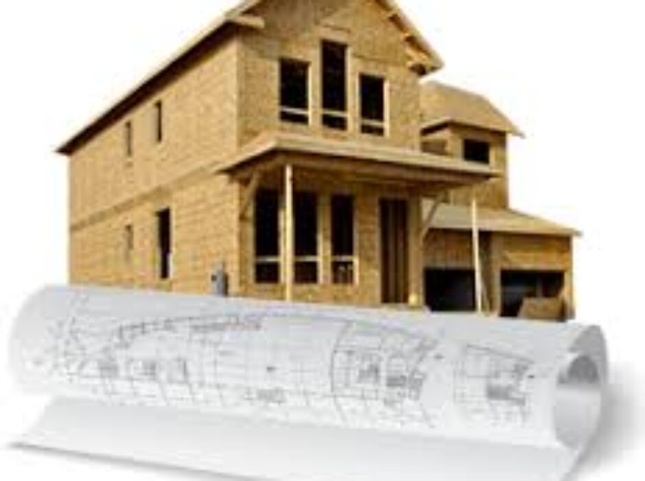 A house with plans and construction drawings on top of it.