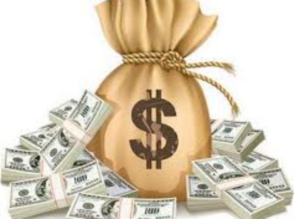 A bag of money with many stacks of cash in it.