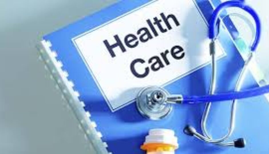 A blue folder with the words health care written on it.