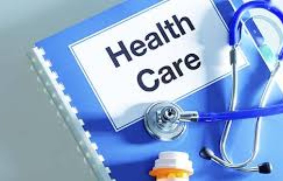 A blue folder with the words health care written on it.