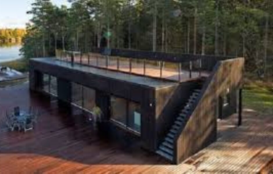 A black house with stairs going up the side.