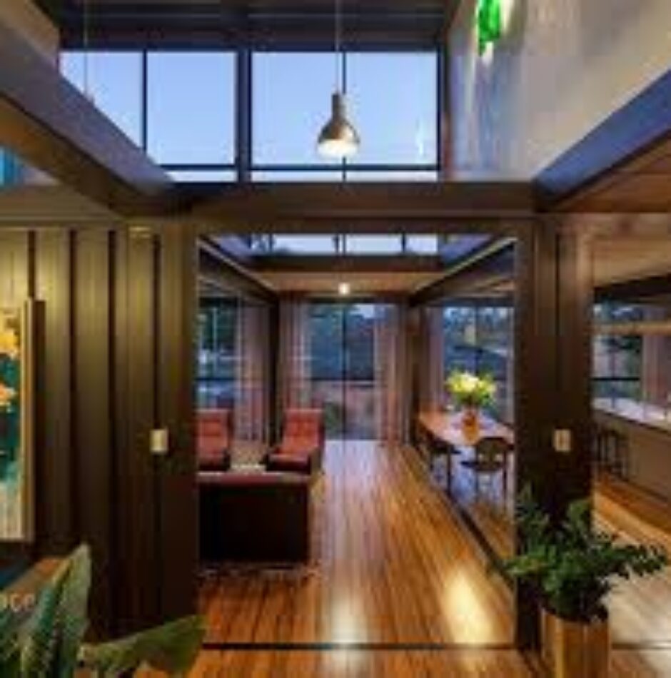 A large open floor plan with wood floors and a skylight.