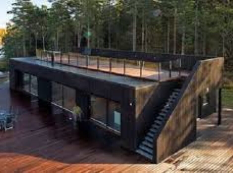 A black house with stairs going up the side.