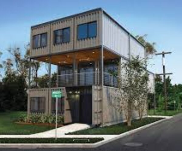 A large house made out of shipping containers.