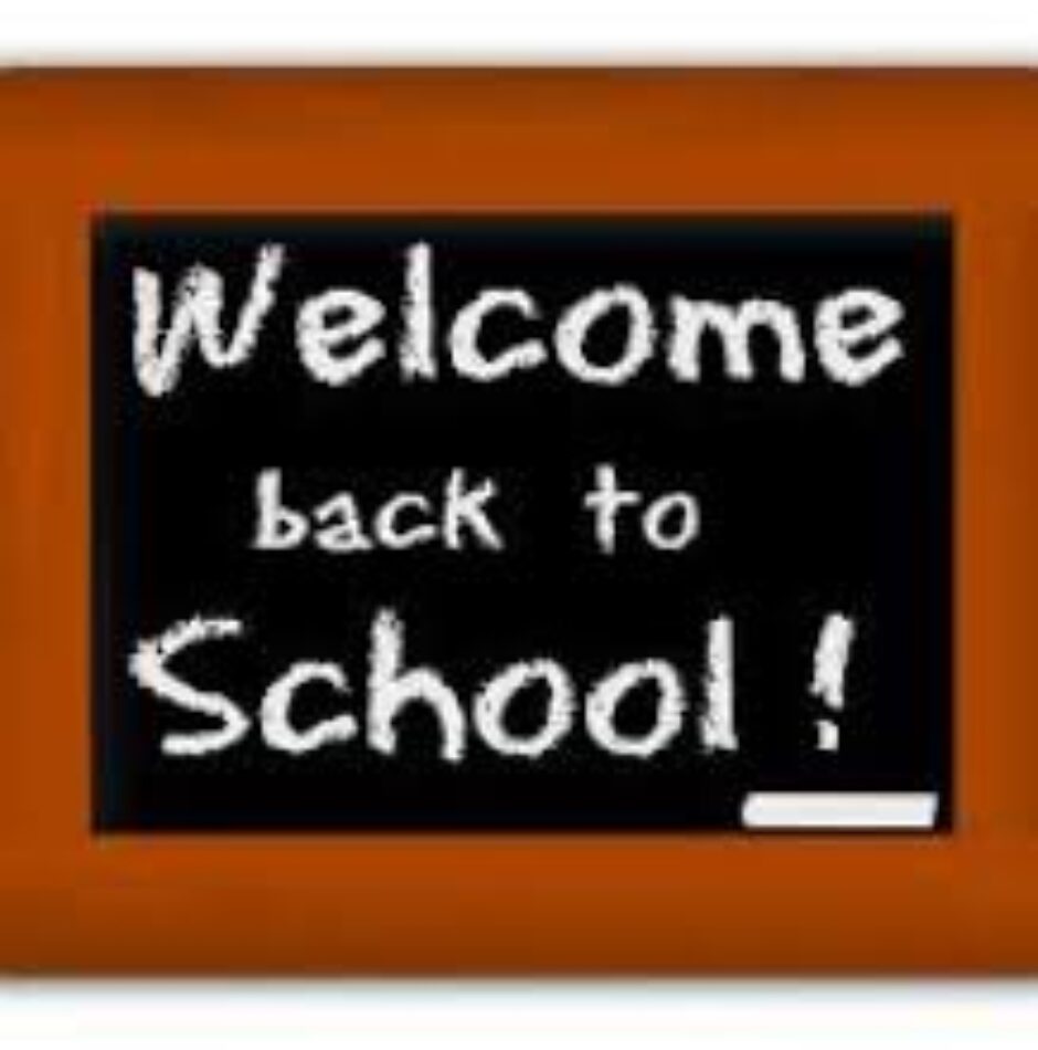 A chalkboard with the words welcome back to school written on it.