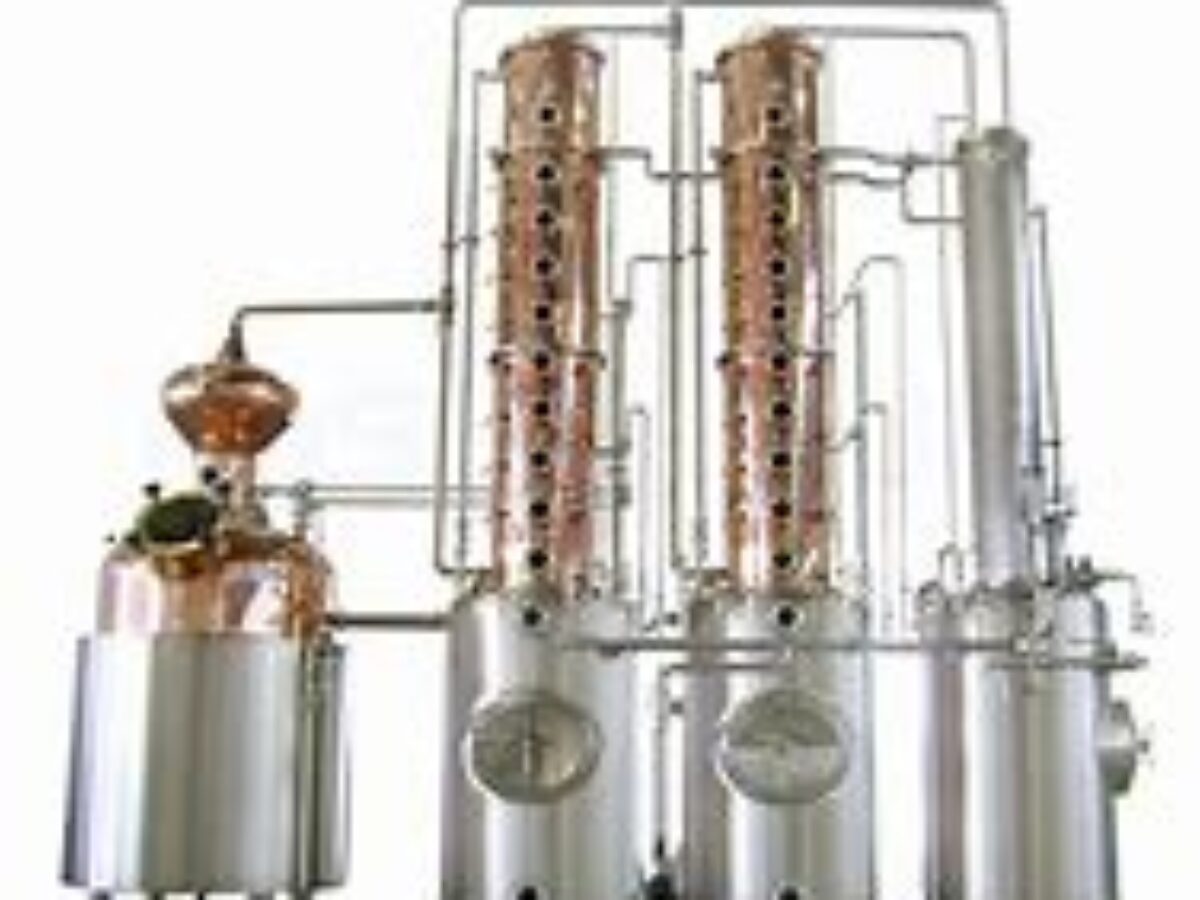 A large copper still with two distillation towers.