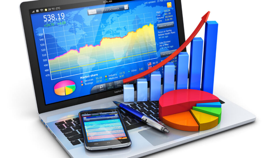 A laptop with graphs and charts on the screen.