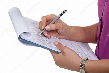 A person writing on paper with pen and pencil.