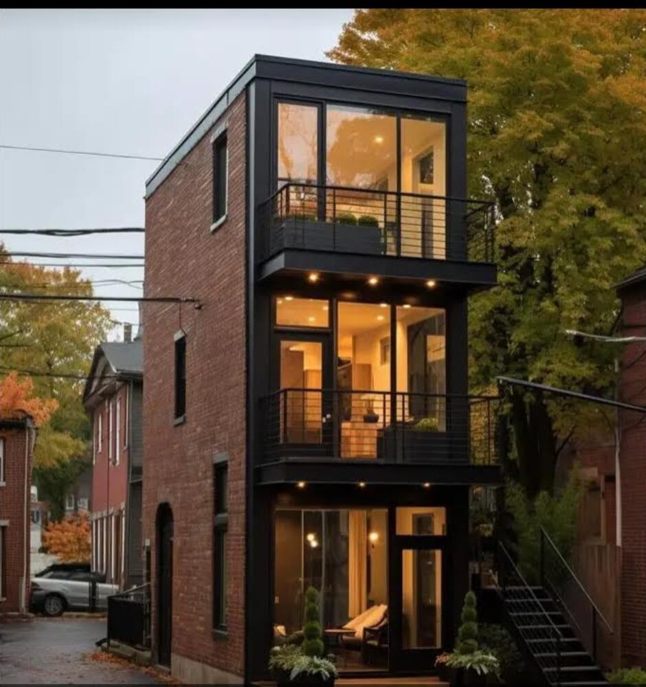 A black and red building with stairs going up the side