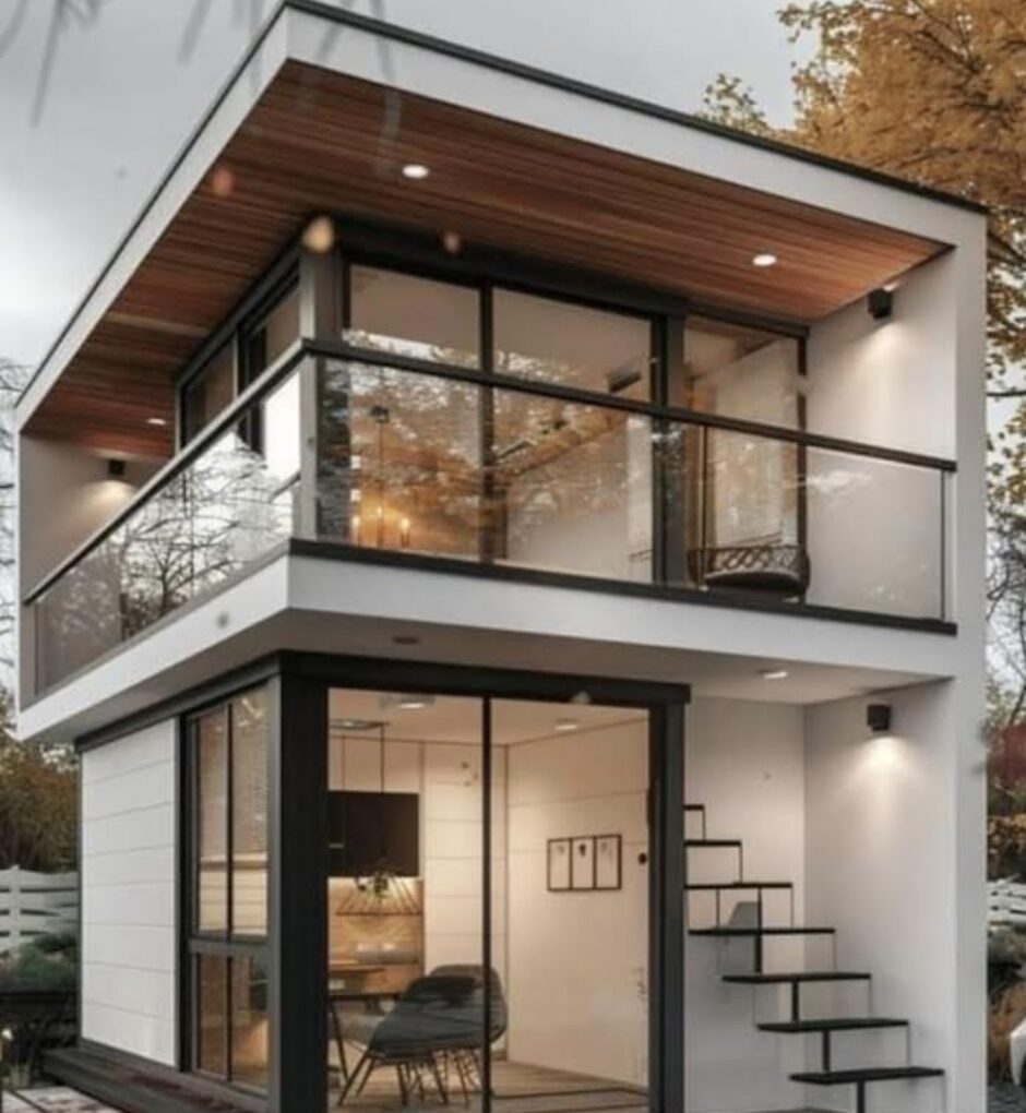 A small house with stairs and balcony in the middle