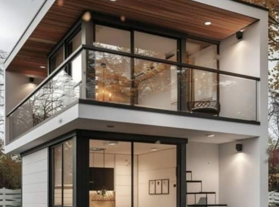 A small house with stairs and balcony in the middle